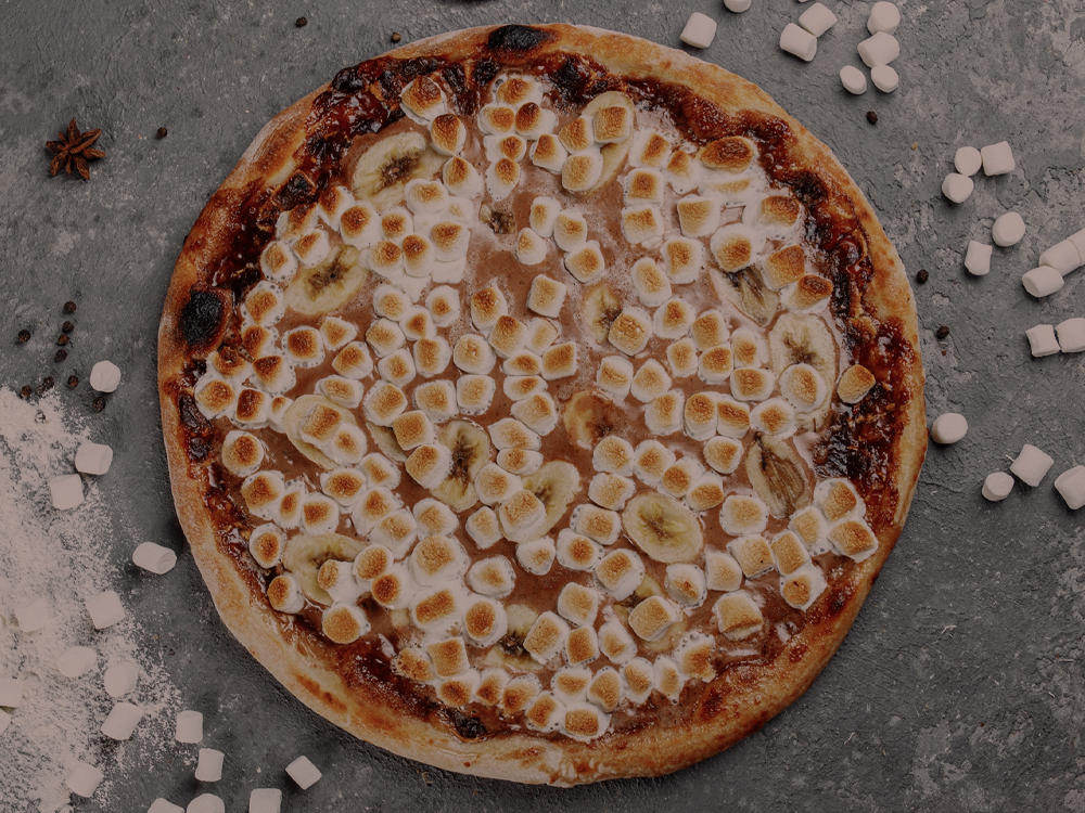 Fotografia ilustrativa - Pizza de chocolate com marshmallow
