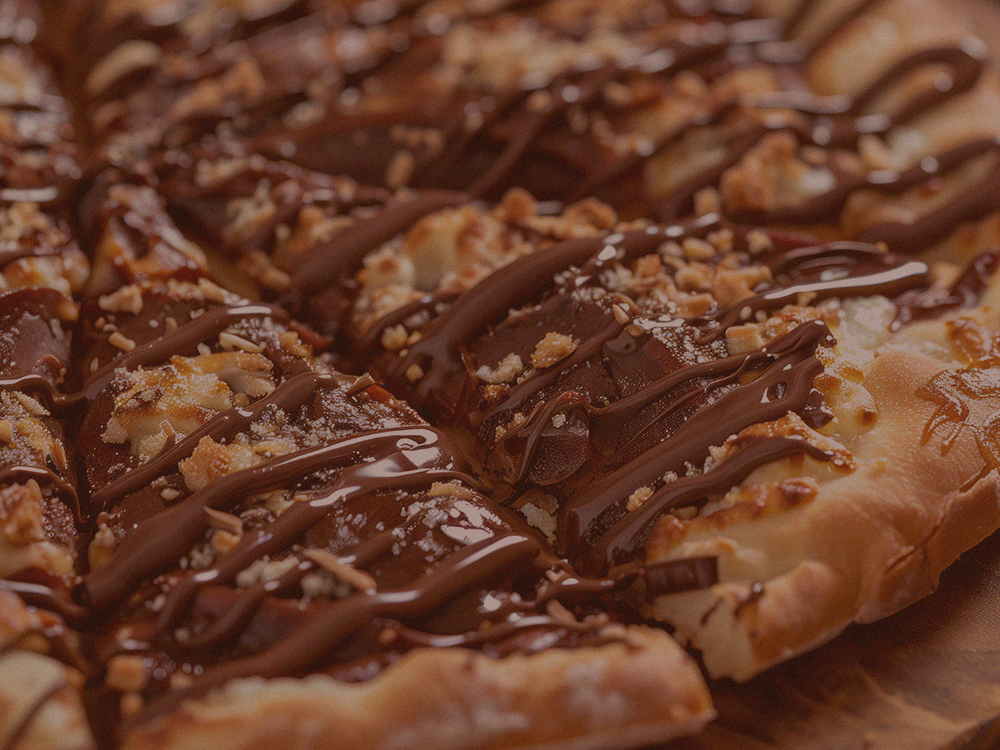 Fotografia ilustrativa de pizza com recheio forneável - chocolate no dia dos pais